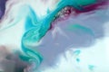 Bright flowing alcohol Ink dark colors on blue background. Acrylic Fluid Art. Liquid marble texture for abstract artwork. Royalty Free Stock Photo