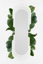 Bright fresh spring abstract figure of white rounded vertical rectangle form as stripe or search bar with tropical green leaves.