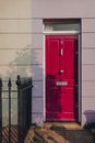 Bright front door on pastel coloured terraced house in Camden, London, UK Royalty Free Stock Photo