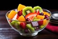 bright fruit salad in a transparent bowl Royalty Free Stock Photo