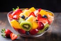 bright fruit salad in a transparent bowl Royalty Free Stock Photo