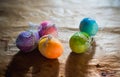 colorful Easter eggs on rustic background