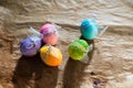 colorful Easter eggs on rustic background