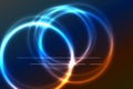 Bright full color rainbow plasma ring on dark background. Several circles intersect. Blue and red color. Bright line segments