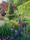 An show garden with flowers and trees at the Chelsea Flower Show in London Royalty Free Stock Photo