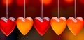 A bright garland of glass hearts on a blurred background