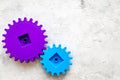 Bright gears for great technology of team work and correct mechanism on stone background top view copyspace