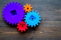 Bright gears for great technology of team work and correct mechanism on wooden background top view copyspace Royalty Free Stock Photo