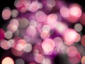 bright glowing lights with a purple blur on a black background abstract Royalty Free Stock Photo