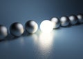 Bright glowing sphere in a row. Leadership concept