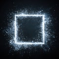 square frame formed by an explosion of sparkling, energetic digital particles and light dust against dark background. This dynamic Royalty Free Stock Photo