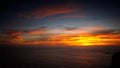 Bright glowing sunset sky over a calm sea in Algarve, Portugal Royalty Free Stock Photo