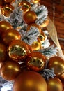 Bright Gold Christmas Ball Ornaments in a White Flocked Tree