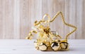Bright golden christmas star ornament with oak leaves and jingle Royalty Free Stock Photo