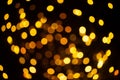 Bright golden glitter festive background. Abstract shimmering circles decorative backdrop. Bokeh lights with shiny Royalty Free Stock Photo