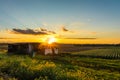 Bright golden sunset in late summer over farmlands in the black dirt region of Pine Island, New York