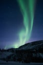 Green Aurora Borealis, northern lights over a hill in Norway Royalty Free Stock Photo