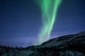 Bright green, Aurora Borealis, northern lights over a hill in Norway Royalty Free Stock Photo