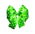 Bright green bow with white polka dots made from silk Royalty Free Stock Photo