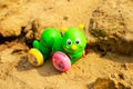 Bright green caterpillar toy in the sandbox. Royalty Free Stock Photo