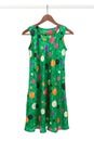 Bright green dress on a wooden hanger