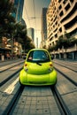 Bright green eco-friendly car standing out in a modern urban environment with skyscrapers. Royalty Free Stock Photo