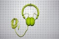 Bright green music headphones for listening to digital music Royalty Free Stock Photo