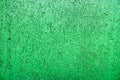 Bright green saturated relief texture of beautifully painted wood with vertical stripes, crack Royalty Free Stock Photo
