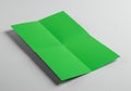 A bright green sheet of paper is shown unfolded, resting on a plain surface. It has Royalty Free Stock Photo