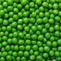 a dense, repetitive mass of bright green shelled peas filling the frame, creating a uniform, natural pattern Royalty Free Stock Photo