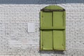 bright green shutter window white brick wall Royalty Free Stock Photo