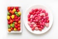 Bright gummy candies in bowls on a white background Royalty Free Stock Photo