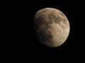 a big half moon lit up against a black sky at night Royalty Free Stock Photo