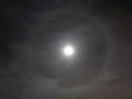 Bright halo around the moon at night