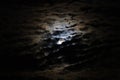 Full moon with dramatic clouds and lunar halo Royalty Free Stock Photo