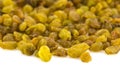 Bright heap of raisins isolated on white background Royalty Free Stock Photo