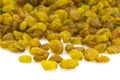 Bright heap of raisins isolated on white background Royalty Free Stock Photo