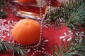 bright holiday background, red texture table with Christmas tree decorations and candles, holiday, a cozy home, time of miracles