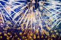 Bright Holiday Fireworks with sparks, comets, colored smoke and vivid nebula on blue sky similar to painting of impressionists.