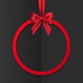 Bright holiday round frame banner hanging with red ribbon and silky bow on black background. Vector illustration