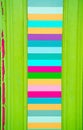 Bright horizonatl color stripes inside rustic vetrical wooden mo Royalty Free Stock Photo