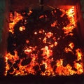 Bright hot coals and burning woods in bbq grill pit. glowing and flaming charcoal barbecue red fire and ash Royalty Free Stock Photo