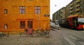 Bright house, the bike and the road with a moving bus in Copenhagen