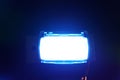 Bright illuminated flashing blue light on a dark background Royalty Free Stock Photo