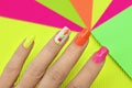 Bright illuminated multicolored manicure.