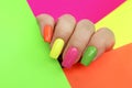 Bright illuminating multicolored fashionable manicure. Royalty Free Stock Photo