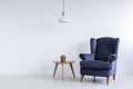 Bright interior with blue armchair