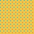 Bright abstract geometric fabric pattern Small orange blue polka dots on yellow background Royalty Free Stock Photo