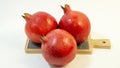 Bright juicy pomegranate fruit, white background Royalty Free Stock Photo