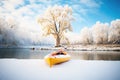 bright kayak on snowy river bend